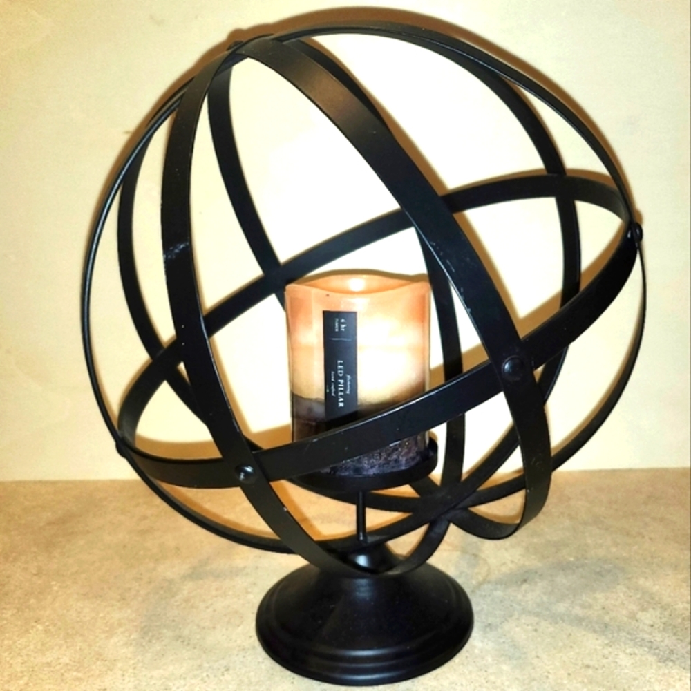 TILTED GLOBE SHAPED BLACK METAL CANDLE HOLDER